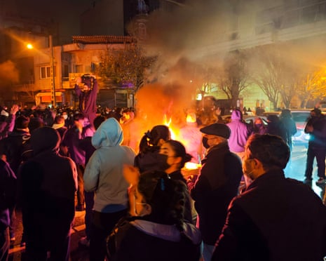 Protesters around a bonfire
