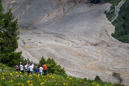 People view the aftermath of the landslide