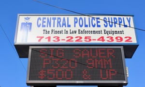 A sign advertising gun sales in Houston, Texas.