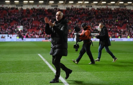 Pep Guardiola applauds the travelling fans at full time
