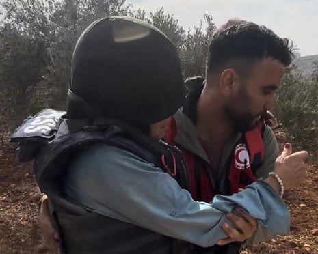 At least six people were injured when a group of masked Israeli settlers descended on an olive grove in Abu Falah, in the occupied West Bank, on Friday