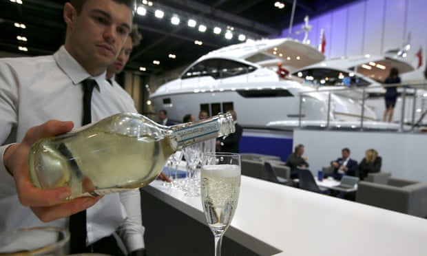 A waiter pours some bubbly at the London Boat Show