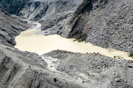 An aerial drone photo shows a view around a barrier lake formed after a mudslide upstream
