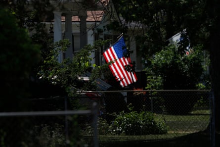 a flag hanging outside of house