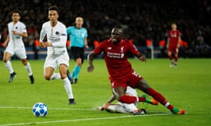 Sadio Mane of Liverpool is shot by Angel Di Maria of PSG.