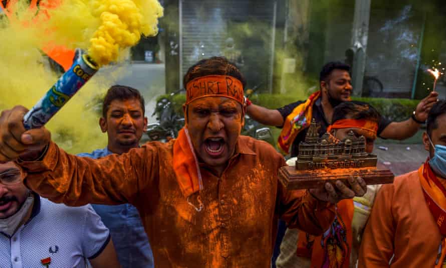Bharatiya Janata party activists and supporters celebrate before the groundbreaking ceremony of the Hindu Ram Temple in New Delhi