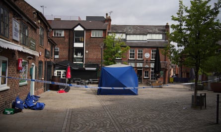 A police tent at the scene on Railway Street, Altrincham, where Rico Burton died.