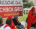 A member of the #BringBackOurGirls Abuja campaign group addresses a protest in Abuja