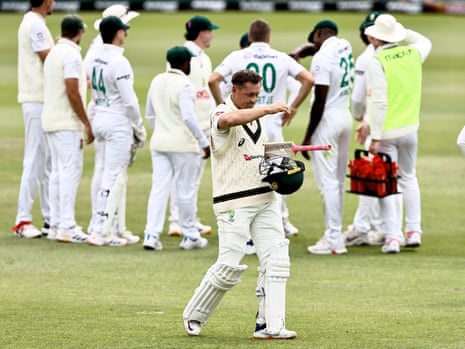 Marnus Labuschagne walks off the field in pads, holding his helmet and bat