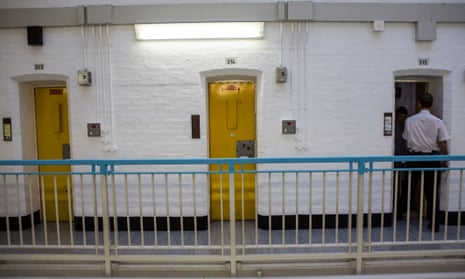 A prison officer checks a cell in HMP Portland, Dorset.