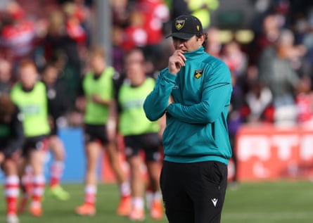 Northampton's Phil Dowson watches his side warm up before facing Gloucester