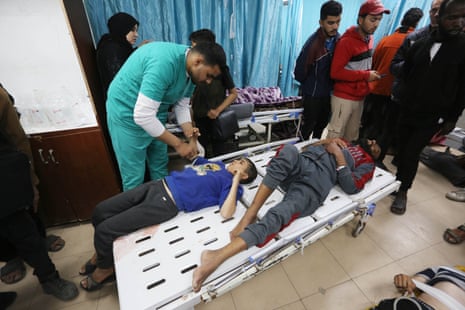 Palestinians, including children, injured by Israeli strikes are brought to Al-Aqsa Martyrs hospital for medical treatment after an Israeli attack at the Nuseirat Refugee Camp in Deir Al Balah, Gaza on April 13, 2024.