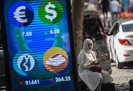 A digital billboard giving updates on various currencies and the Turkish stock exchange in Istanbul today.