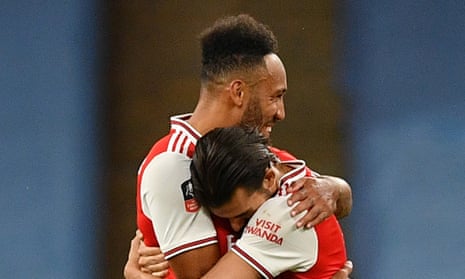 Arsenal’s Pierre-Emerick Aubameyang (left) and Dani Ceballos celebrate after the final whistle. The manager will have to work hard to keep both at the club this summer.