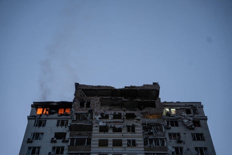An apartment building burns after being damaged during the Russian drone strike on Kyiv.