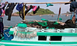 Fish drying on a boat in the port of Bang Saphan, Thailand.