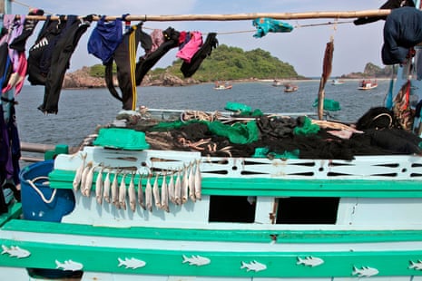 Fish are seen drying on a boat in the Thai fishing port of Bang Saphan