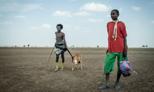 Men on a drought-ravaged field in Ethiopia