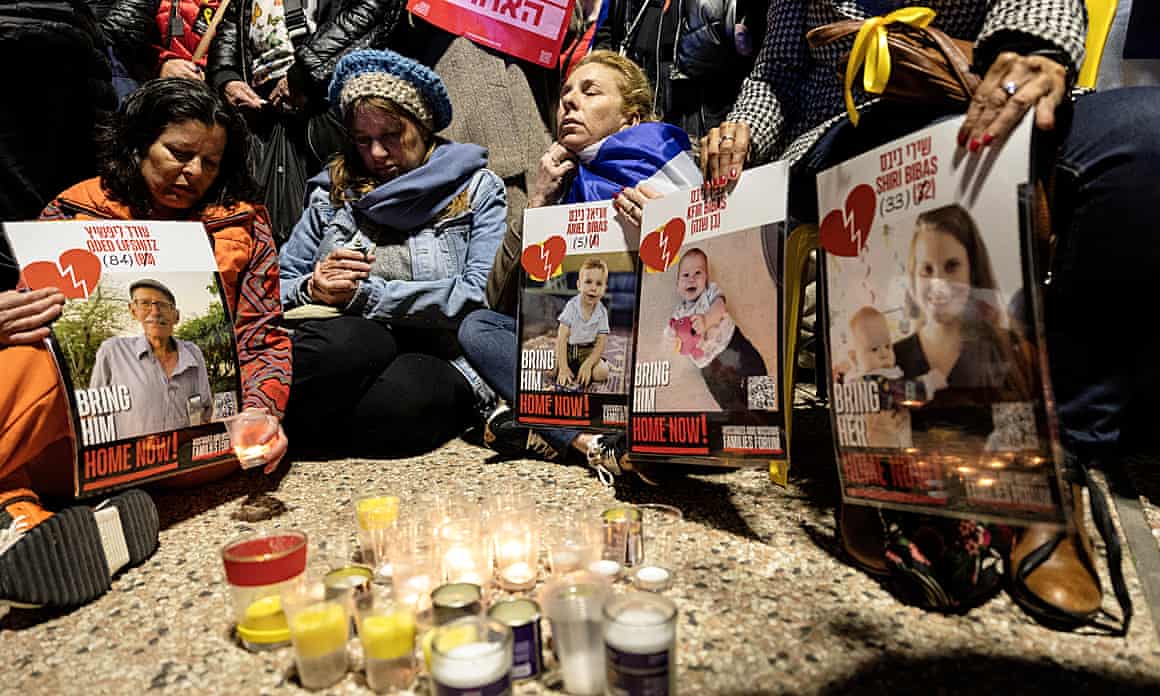 People in Tel Aviv light candles and mourn Israeli hostages earlier this week.