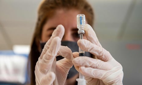pharmacist prepares vaccine