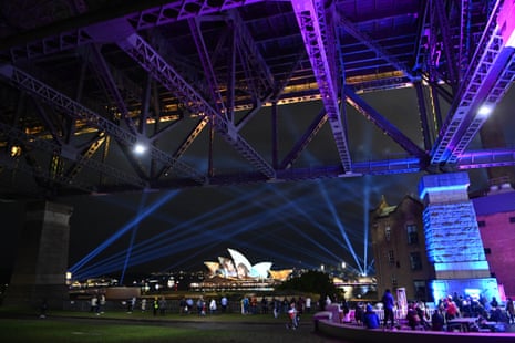 The Opera House seen through a lit-up Harbour Bridge