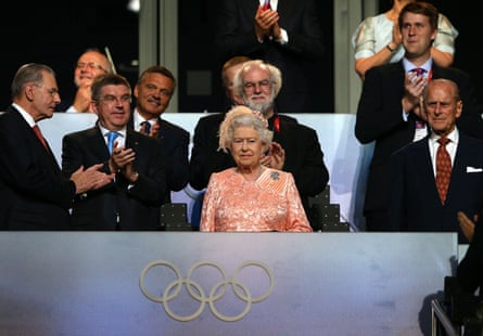 Queen Elizabeth II attends the opening of the London 2012 Olympic Games, with Prince Phillip on her right and other dignitaries