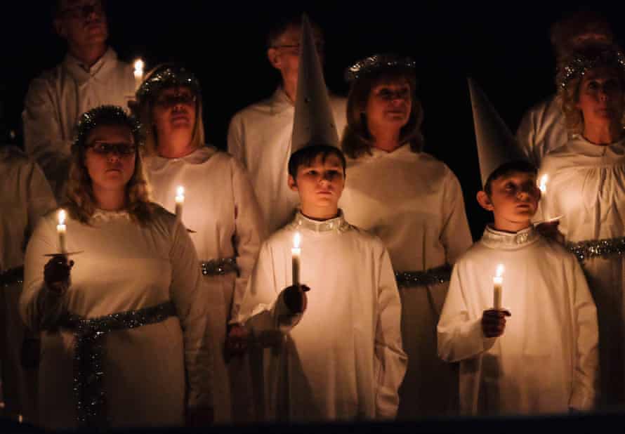 Choir singing carols by candlelight