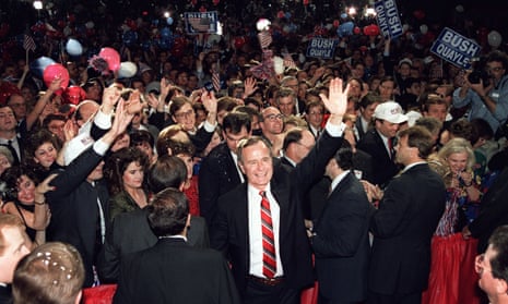 George Bush wades through the crowd on 8 November 1988 following his presidential win.