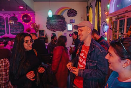 Volunteers with the Zohran campaign Areeba Tariq, 32, Jon W., 44, and Mac Nichols, 26, debrief after an evening of canvassing at Misfit Moon in Bushwick.