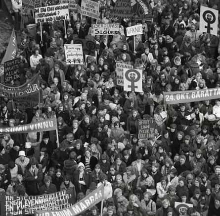 A big crowd of women holding placards