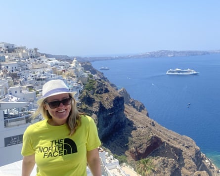 A holiday photo of Ellen Mulvey smiling in a sunny, seaside setting