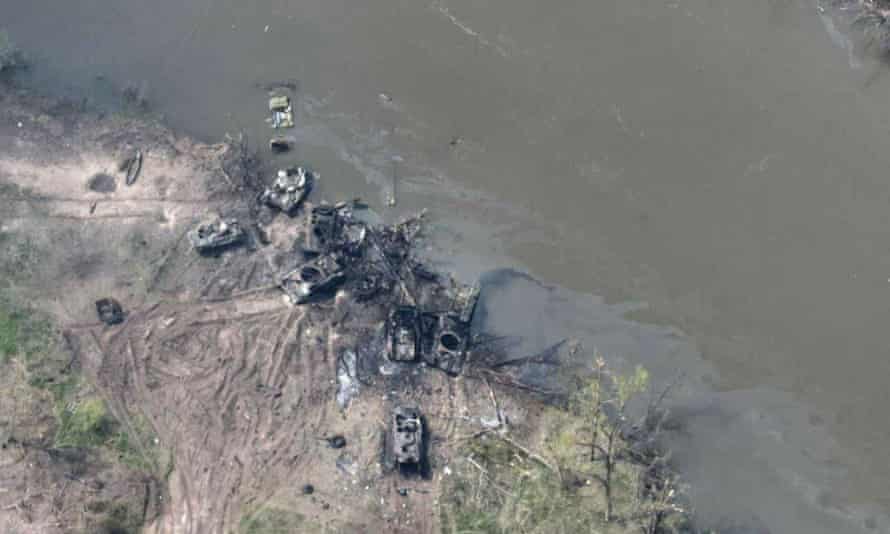 A photograph   provided by Ukrainian equipped  forces showing destroyed oregon  damaged Russian armoured vehicles connected  the banks of the Donets River.