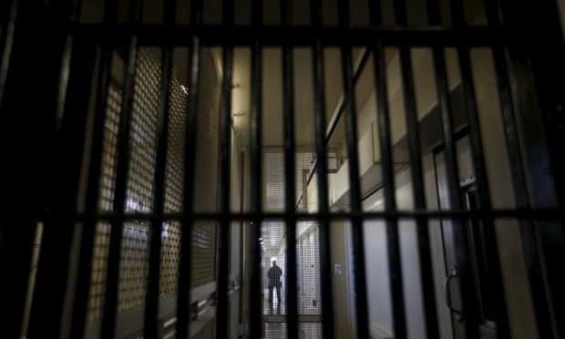 A guard stands in a prison