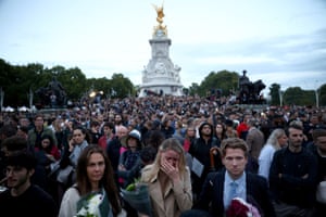 People react outside Buckingham Palace