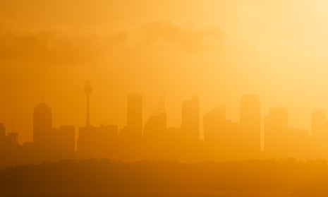 Sydney skyline silhouetted against the setting sun on a hot summers day