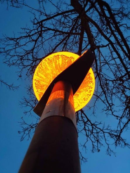 A Sarah Lee photograph of a Belisha beacon from below