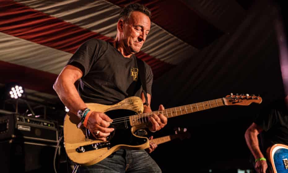 Bruce Springsteen playing at the opening of the Springsteen: His Hometown exhibition
