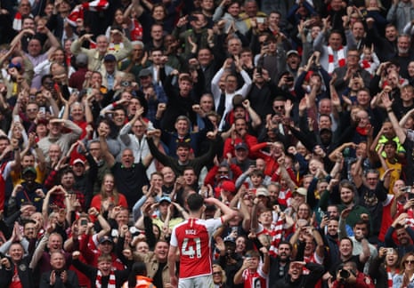Arsenal fans celebrate after Declan Rice scored his side's third goal against Bournemouth.