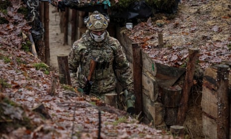 A Ukrainian border guard near the border with Belarus in the Volyn region.