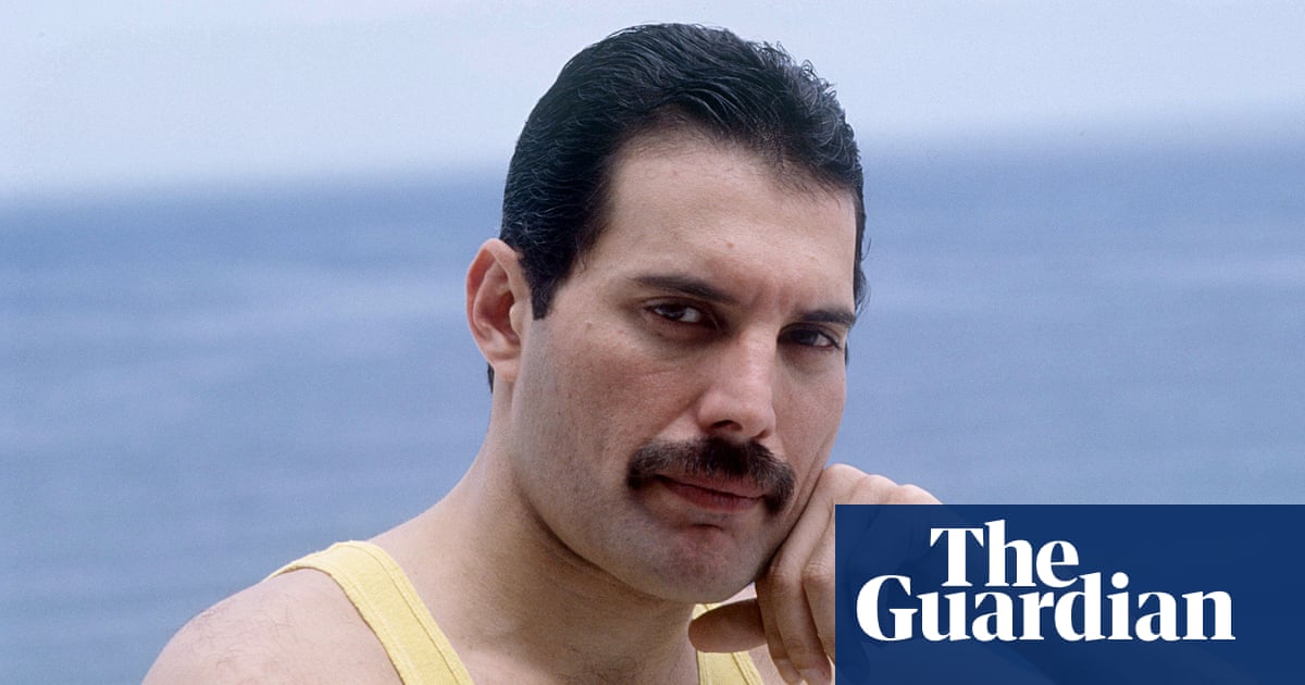 Freddie Mercury performing on stage