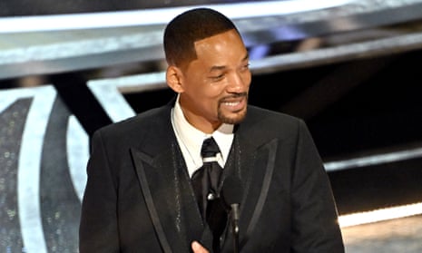 Will Smith accepts the Oscar for best actor. 