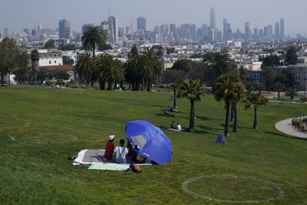 A group sits inside a circle designed to encourage social distancing at Dolores Park, San Francisco.
