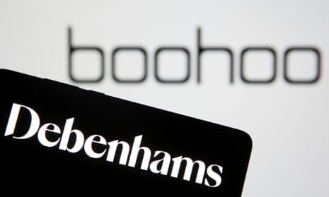 Debenhams logo is seen on smartphone in front of a displayed Boohoo logo.