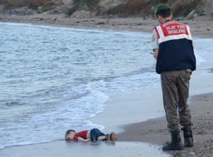 Young boy washed up on the beach.