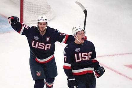 Matthew Tkachuk and Brady Tkachuk celebrate after a goal during a US game.