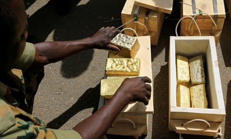 Sudanese Rapid Support Forces display gold bars seized from a plane that landed at Khartoum airport as part of an investigation into possible smuggling