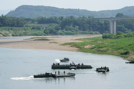 US army soldiers conduct a training exercise on a river in Yeoncheon, South Korea, near the border with North Korea, on Tuesday.