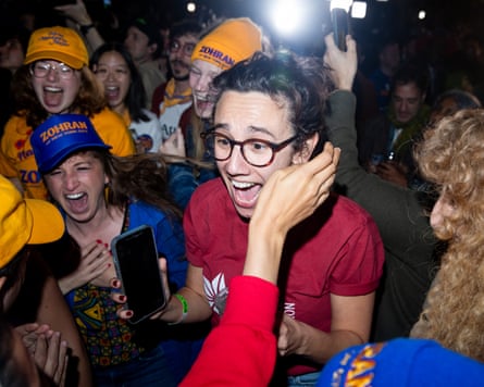 Supporters of Zohran Mamdani cheer at his election night watch party.