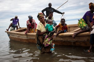 UgandaRefugees from Tchomia in the Democratic Republic of the Congo arrive at the Nsonga landing site. The perilous journey across Lake Albert can take up to two days