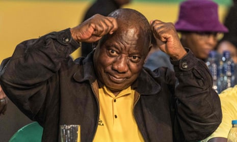 Cyril Ramaphosa gestures after being re-elected as ANC leader